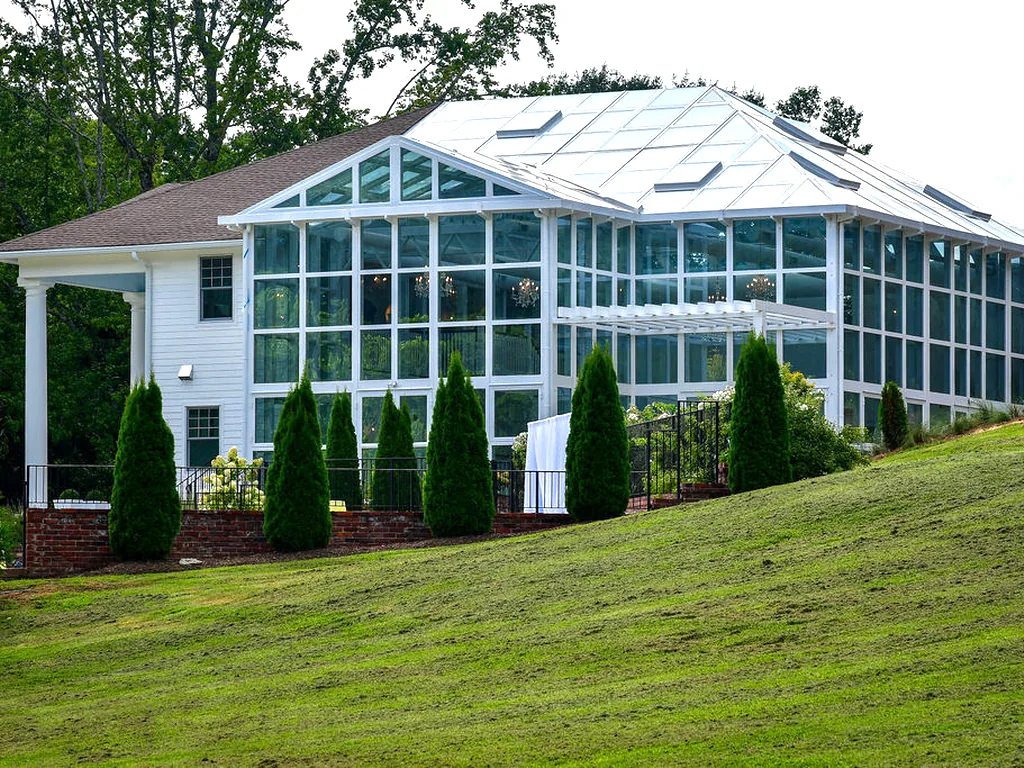 The conservatory from the lawn, glass on three sides