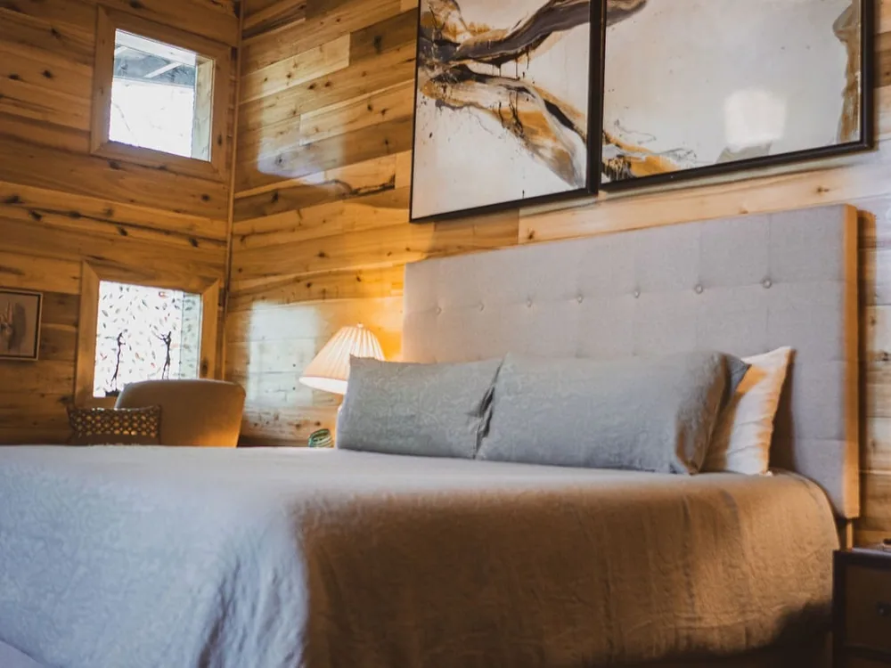 The bedroom, the king bed under the boards