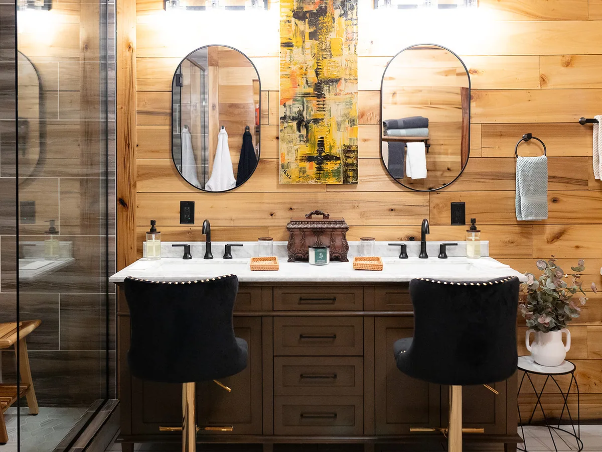 A cottage bathroom in timber, twin basins under twin mirrors