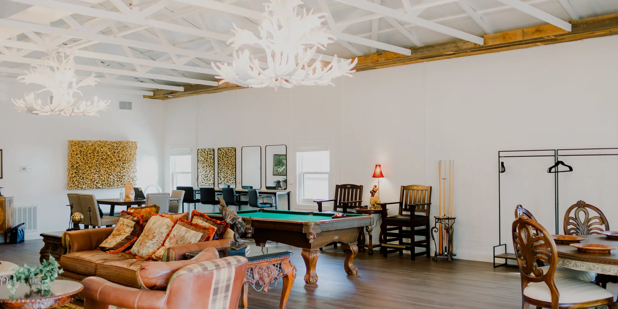The Mahogany Suite in the Lodge, the pool table under antler chandeliers