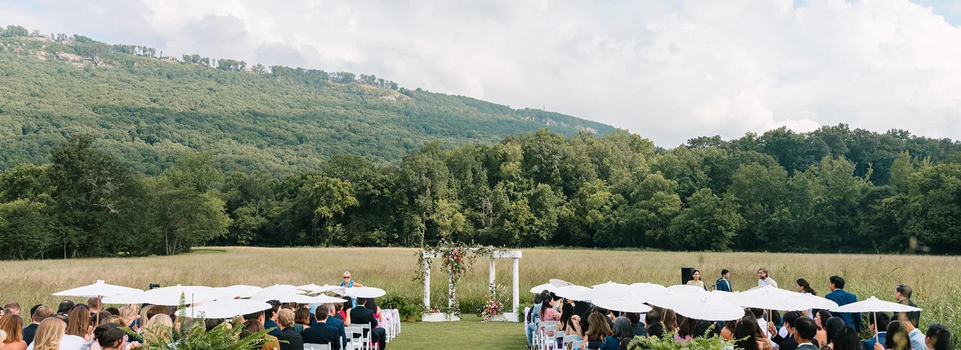 The ceremony in the meadow, the ridge behind the congregation
